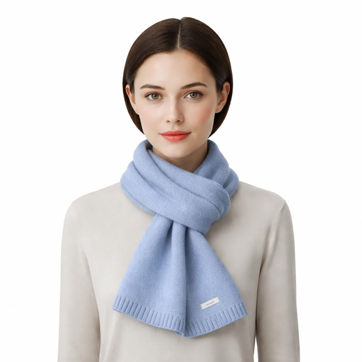 Woman wearing a light blue scarf on a white background